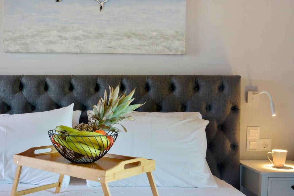 Breakfast tray with fruit on the double bed